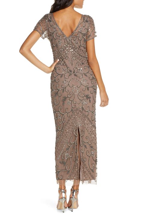 This gown also features a dramatic high neckline with cap sleeves for the desired coverage. . Pisarro nights gowns